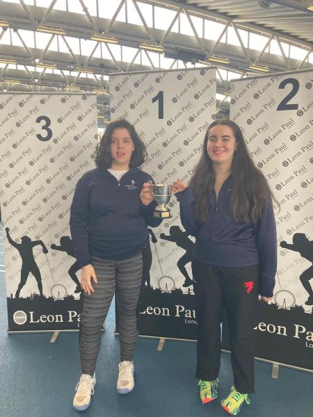 Amelie and Ellie R compete in the Public Schools Fencing Competition