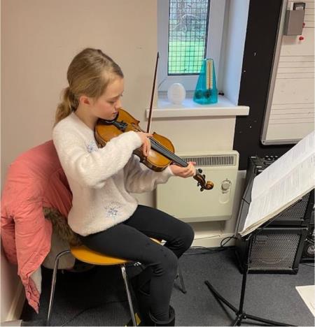 Sophie gains a distinction in her grade 2 violin exam